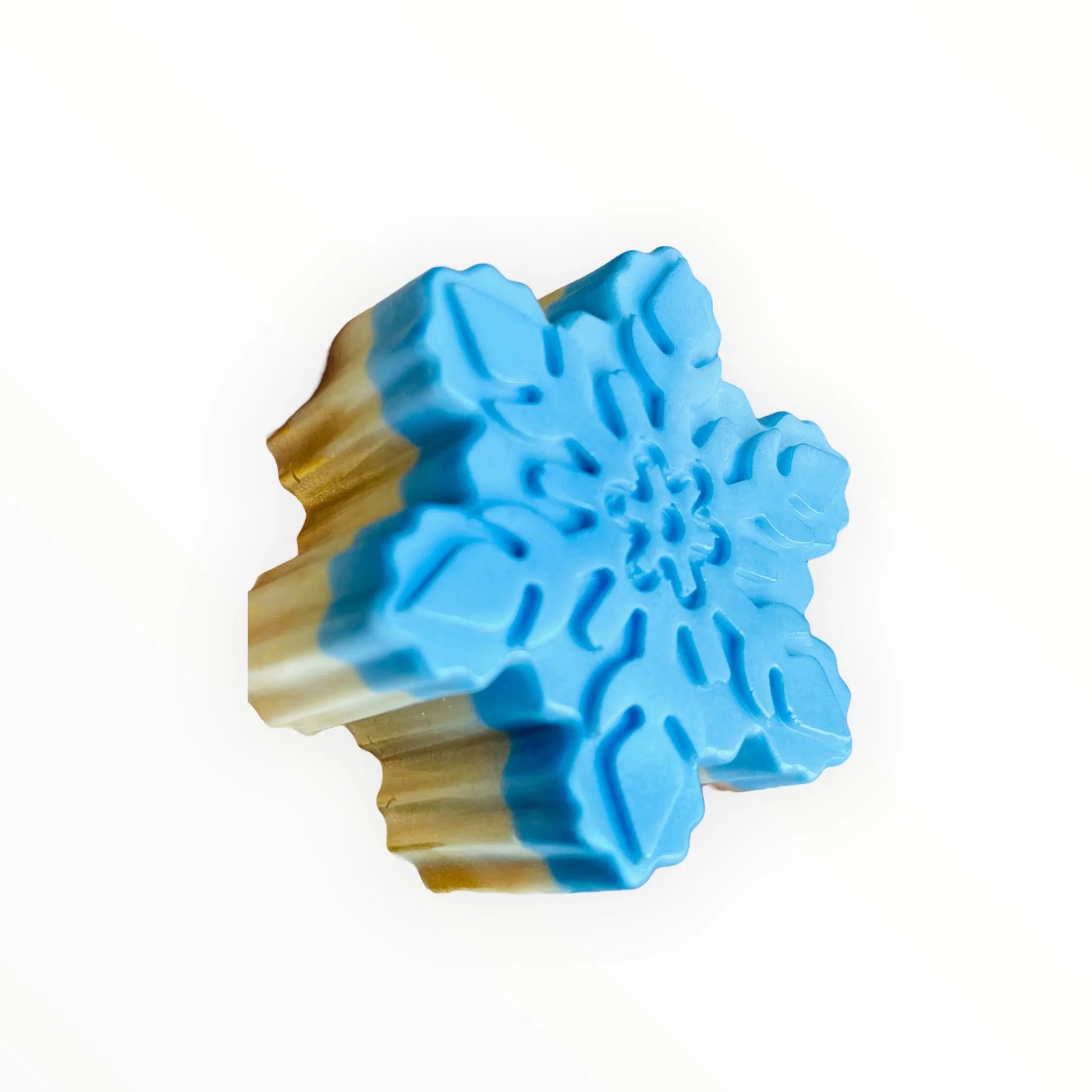 Blue snowflake-shaped cookie cutter on a white background