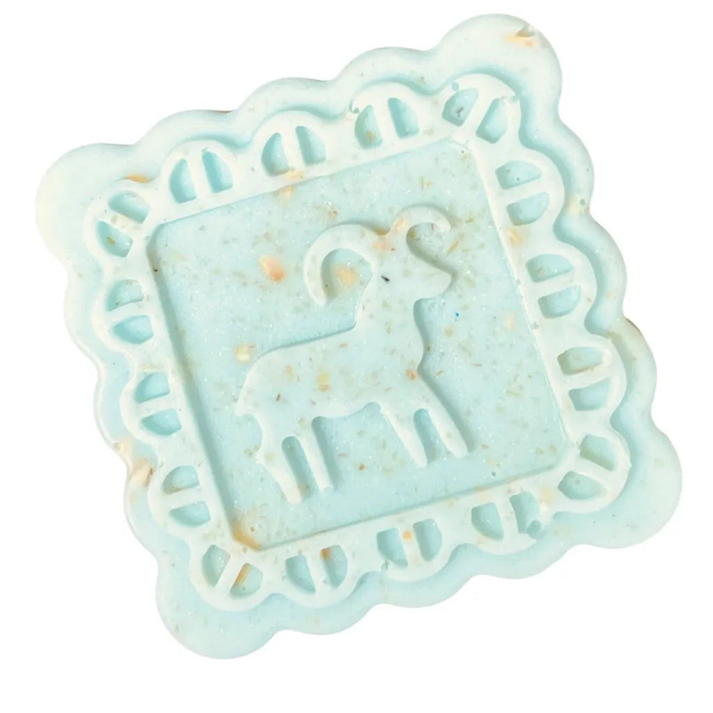 Light blue soap with a deer design on a white background