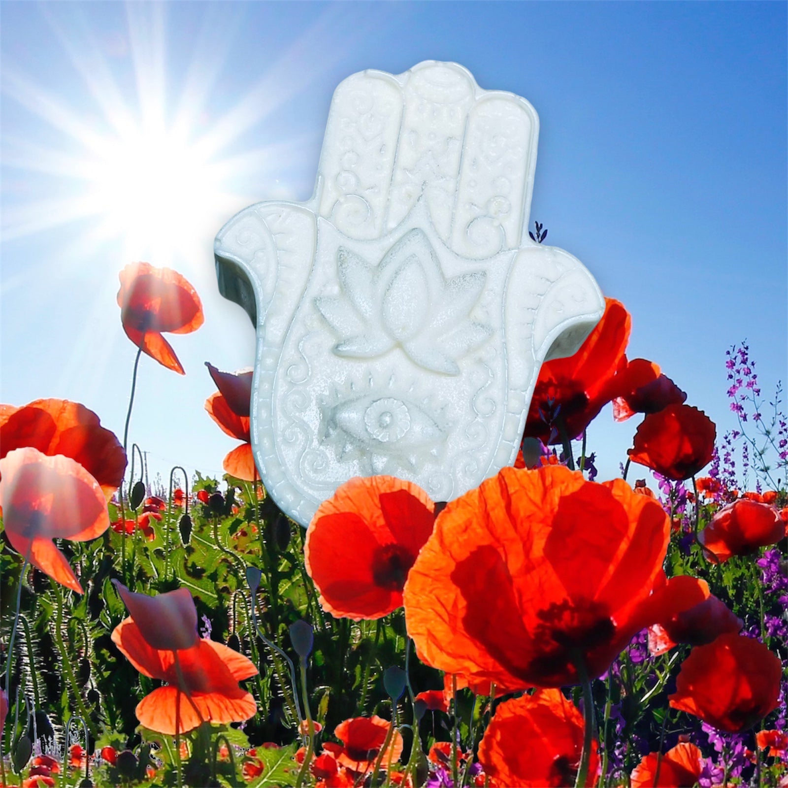 White Hamsa hand with red flowers and blue sky