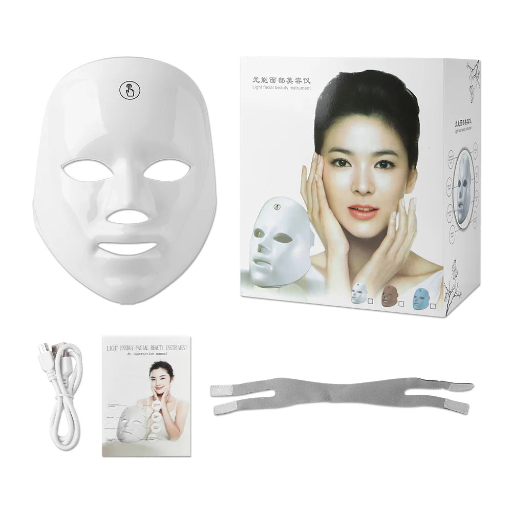 White facial mask with packaging, cable, and straps on a white background