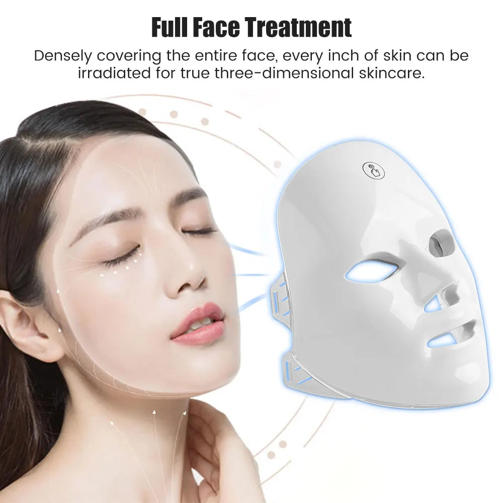 Woman receiving full face treatment with a LED face mask.