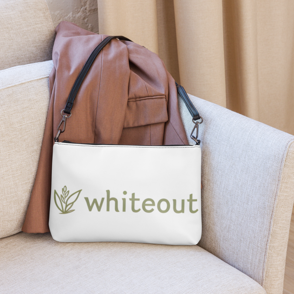 White bag with 'whiteout' logo on a beige couch