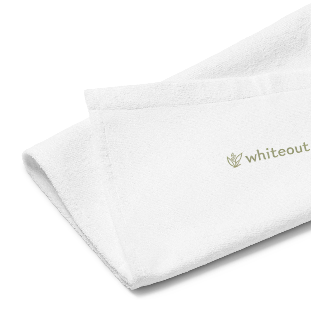 White towel with 'whiteout' branding on a white background