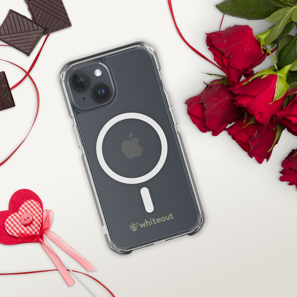 Phone case with Apple logo on a white surface with roses and chocolates