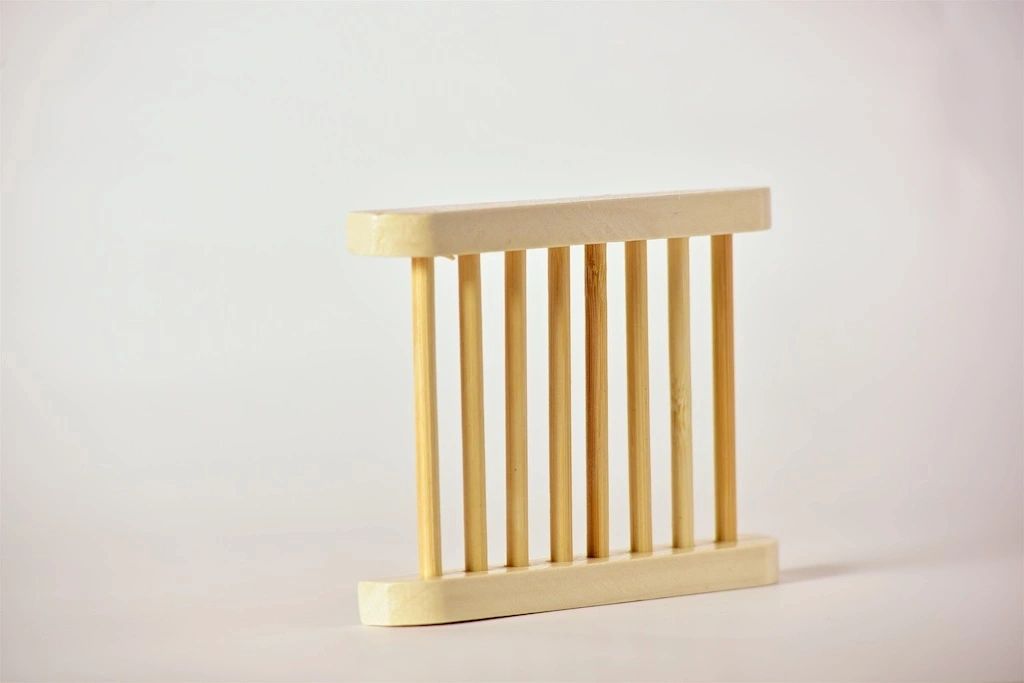 Wooden towel rack on a light background