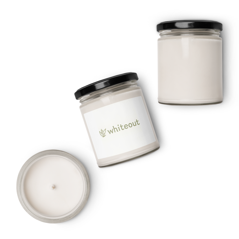 Two candles with black lids on a white background, featuring the brand 'Whiteout'.