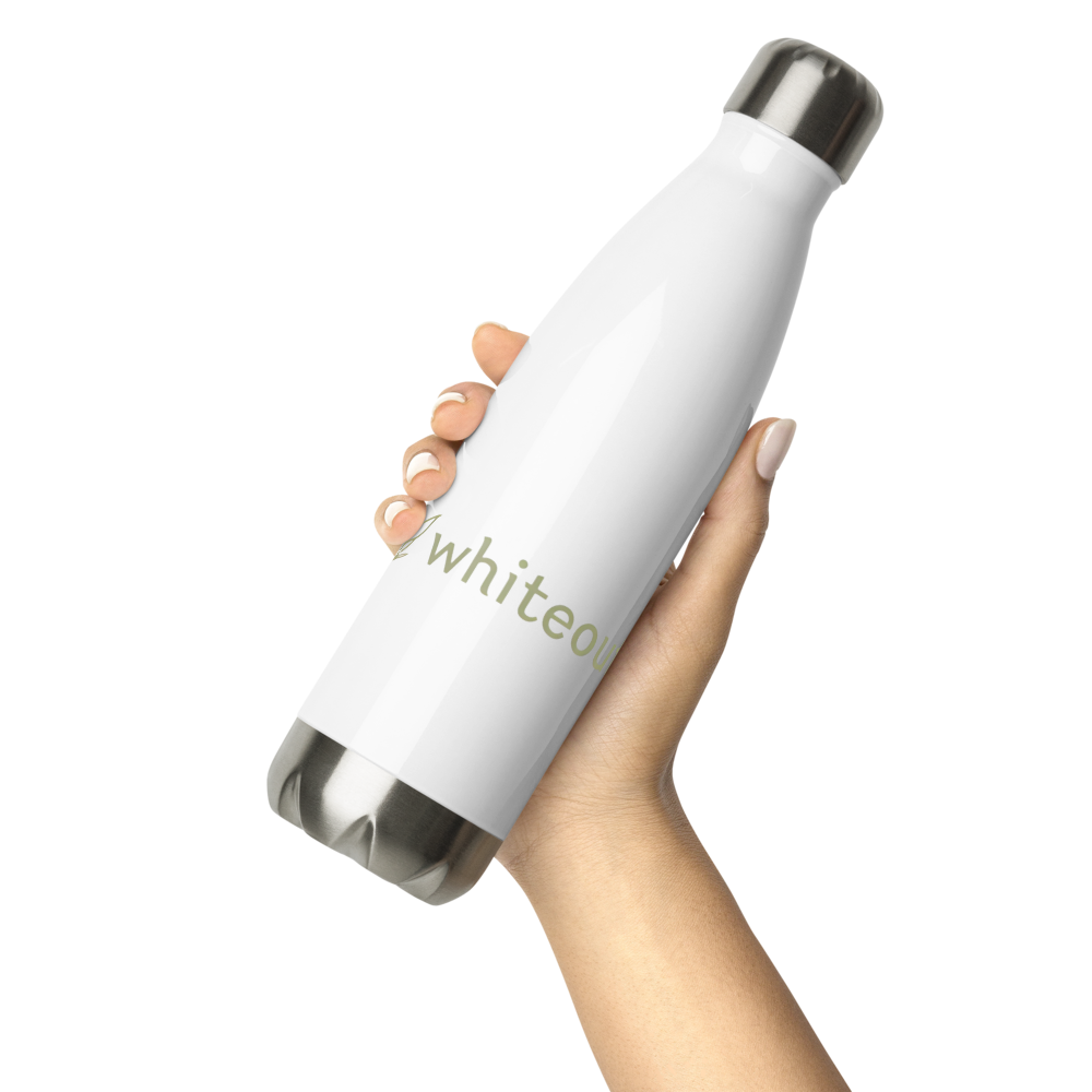 White insulated bottle with 'whiteout' branding held by a hand on a white background